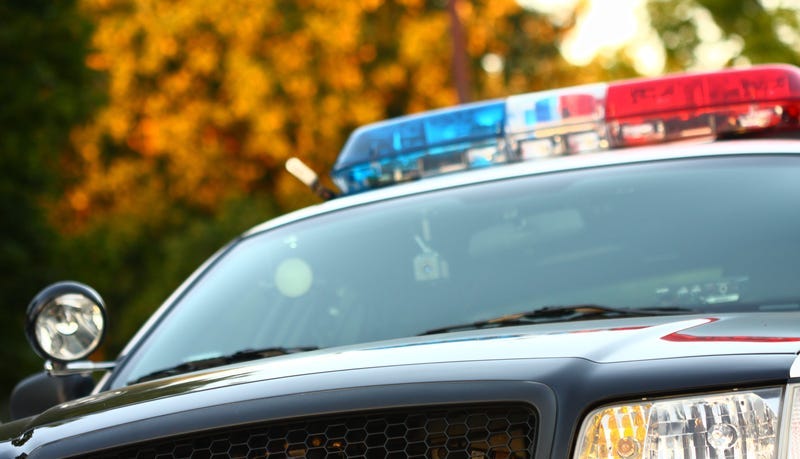 Front view of police car with siren and windshield