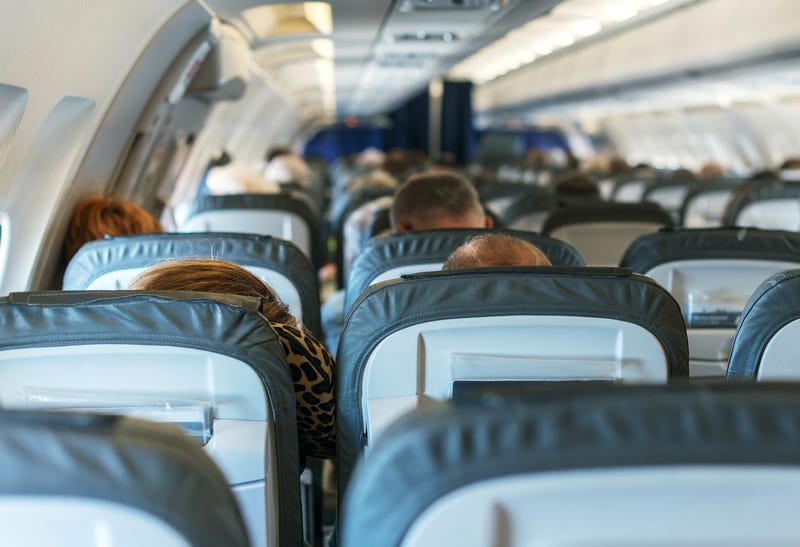 Inside of the plane with passengers.