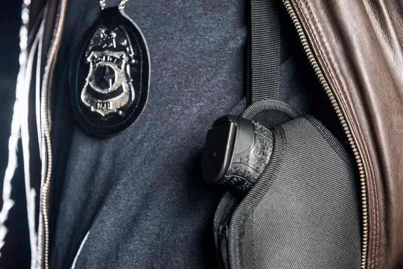 Police Officer Badge And Gun