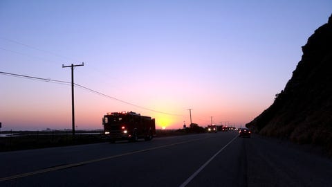 Fire fighters in trucks