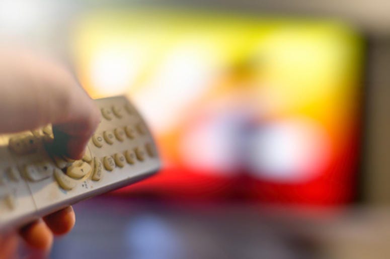 Using a TV remote.