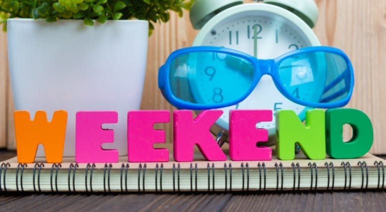 WEEKEND letters text and notebook paper, alarm clock and little