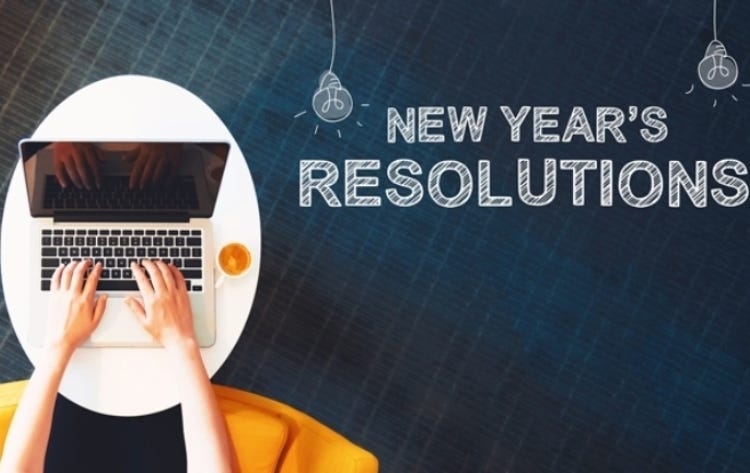 New Year`s Resolutions with person using a laptop