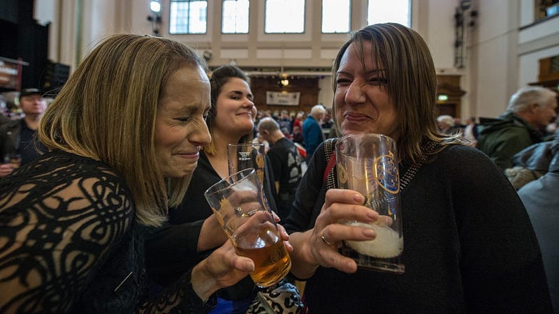 Debroah Cook, 42, Lauren Friend, 27, and her stepmother Dawn Friend, 43, share a laugh over beer and stout at the London Drinker Beer and Cider Festival at the Camden Centre on March 2, 2016 in London, England.