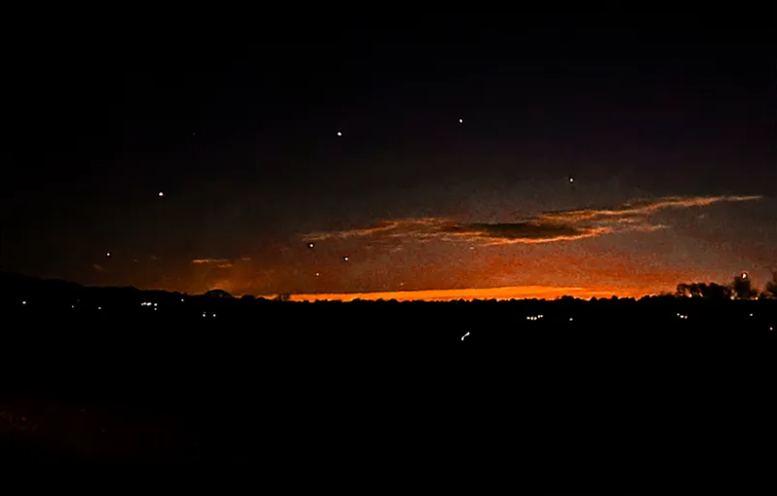 This photo provided by Trisha Bushey shows the evening sky and points of light near in Lebanon Township, N.J., on Thursday, Dec. 5, 2024.