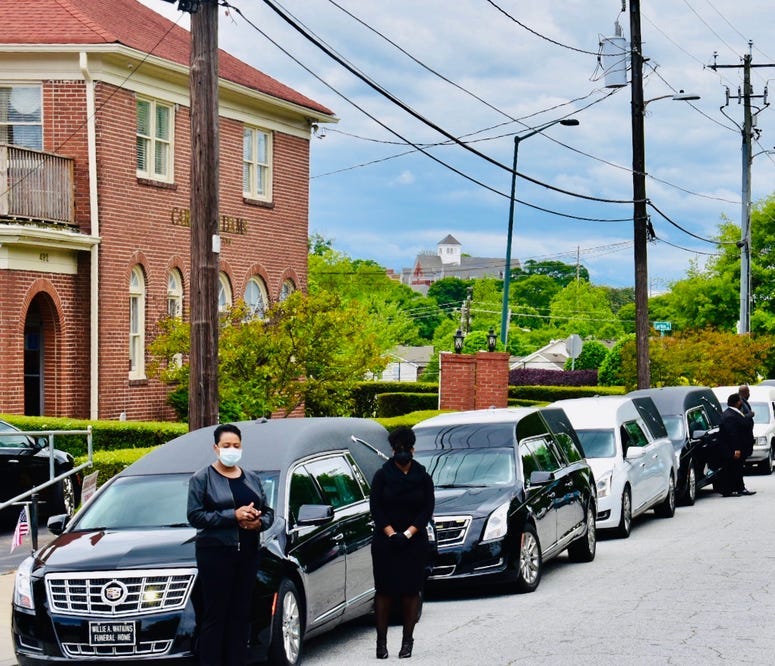 Funeral procession prepares to leave funeral home in southwest Atlanta to protest the reopening of Georgia during the COVID-19 pandemic
