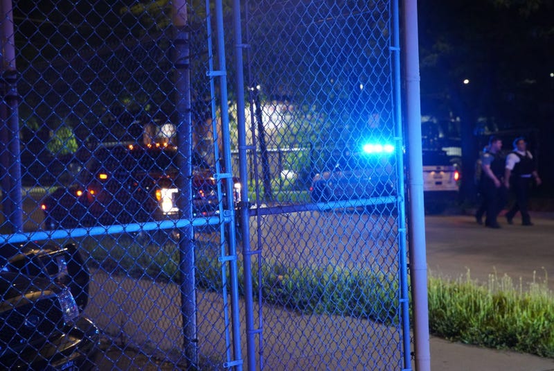 Chicago police gather at the intersection of Western Avenue and Fulton Street, where a police vehicle was rear-ended June 25, 2019.