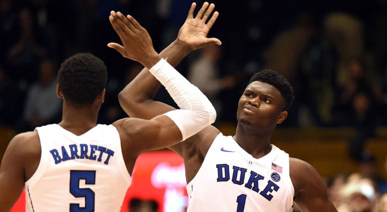 Duke Blue Devils forward Zion Williamson (1) and Duke Blue Devils forward R.J. Barrett (5) high five during the second half against the Hartford Hawks on Dec. 5, 2018, at Cameron Indoor Stadium in Durham, North Carolina.