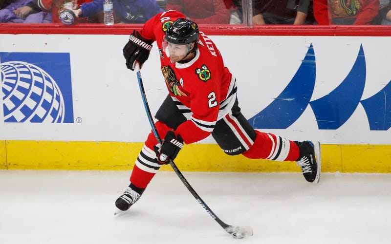 Blackhawks defenseman Duncan Keith (2) attempts a shot against the Canucks.