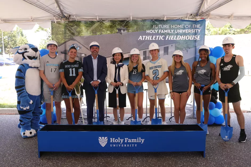 Trustees past and present, students and alumni, faculty and staff attend a ground-breaking ceremony. 