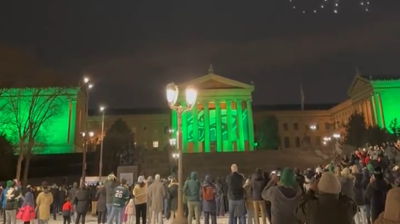 Fans watch drone show at the art museum steps