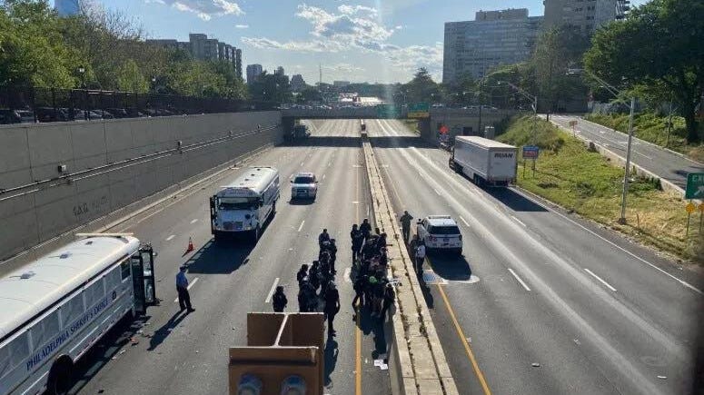 Philadelphia police officers arrest protesters on the Vine Street Expressway on June 1, 2020.
