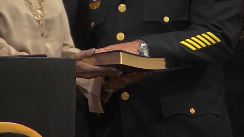 Commissioner Kevin Bethel put his hands on the Bible as he swore to protect the city.