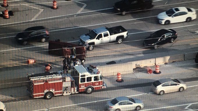 A group of good Samaritans helped pull the driver out of a pickup that rolled over Monday on the Reagan Memorial Tollway in west suburban Oak Brook.