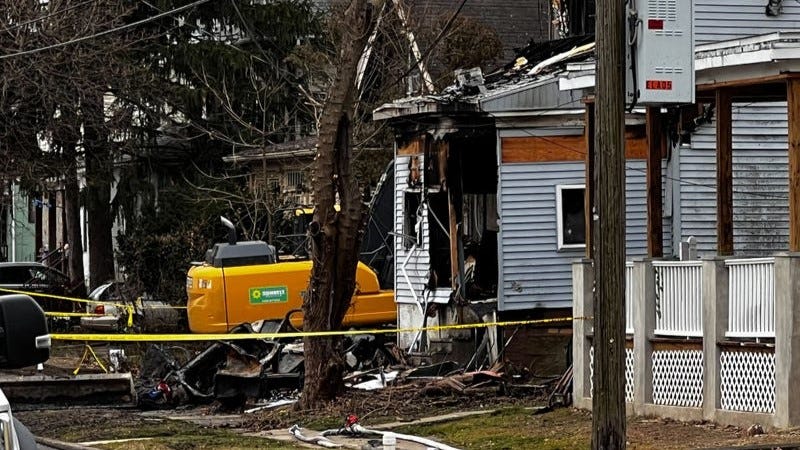 Crews demolish the wreckage of the Le house in East Lansdowne.
