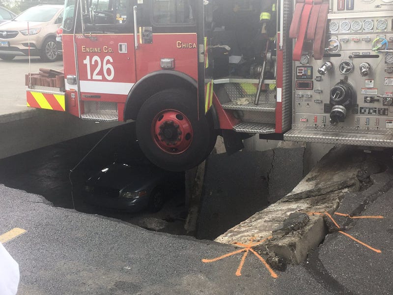 Part of a parking garage collapsed Tuesday under a fire engine in South Shore on the South Side.
