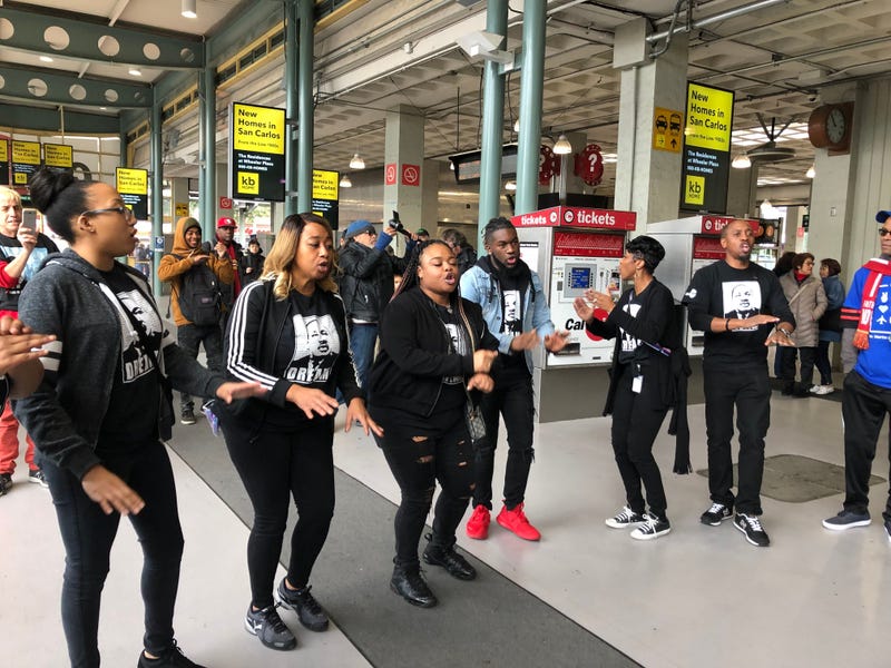Singers that rode the Celebration Trade, which took riders from the South Bay to San Francisco to attend the MLK Day march, serenade the crowd at 4th Street CalTrain station in San Francisco on Monday, 20th, 2020.