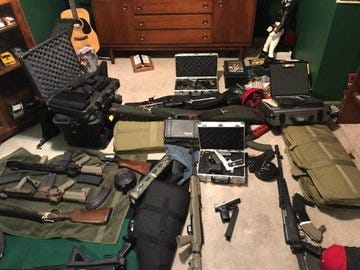 Two people are in custody Friday after police discovered a stash of guns at a home in Lawndale on the West Side.