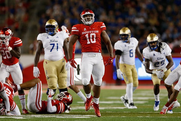 Ed Oliver celebrates a play at the University of Houston. 