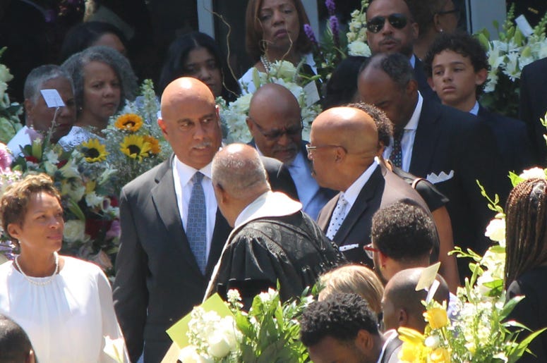Dr. Christopher Edwards is seeing exiting the funeral of his two children and ex-wife