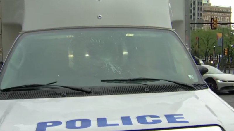 Police truck with smashed-in windshield