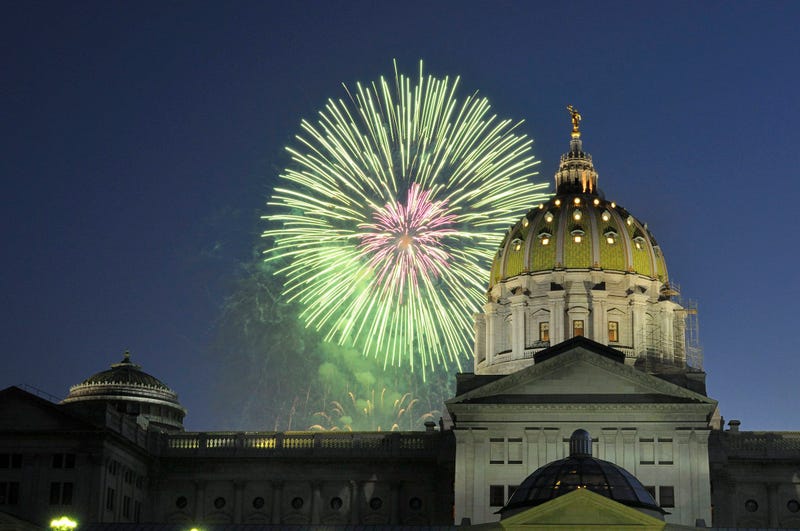 Fireworks explode over the Pennsylvania state Capitol building.