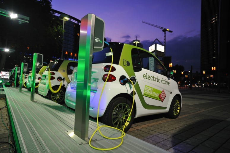 Electric cars charge at charging station