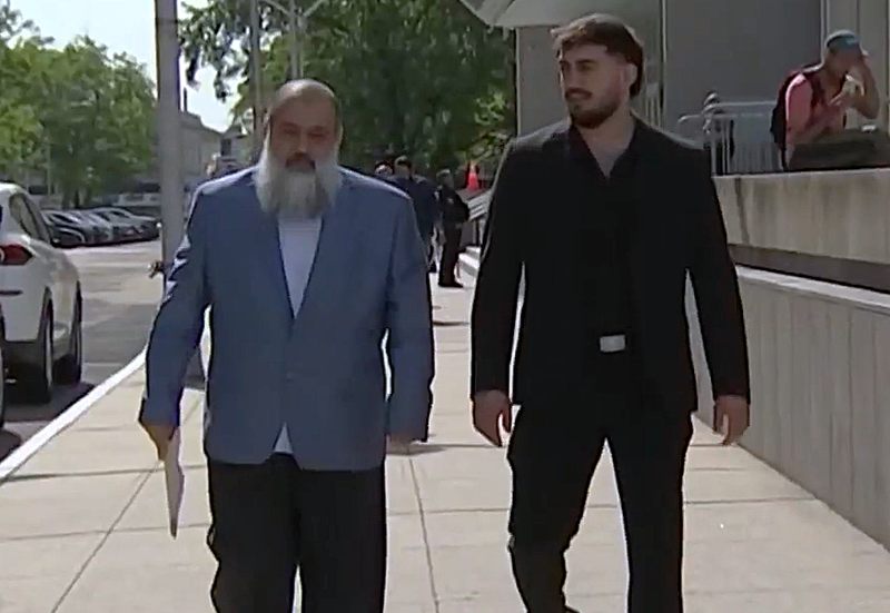 Celal Emanet appears at a court hearing in Newark with his oldest son, Muhammad.