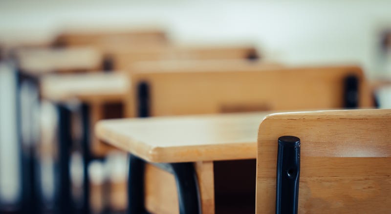 An empty classroom and student desks
