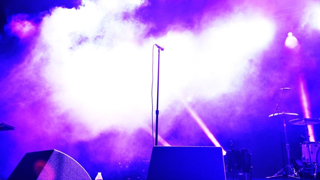 Dead rapper's body displayed on stage during memorial service at club