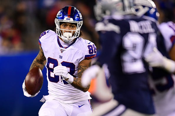 Evan Engram runs down field for the Giants. 