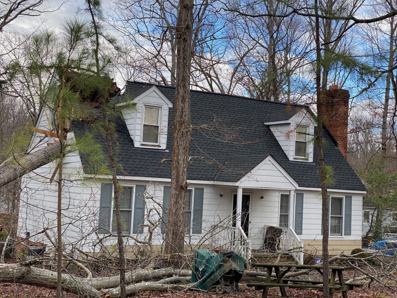 A tree falls into a home in Chesterfield County.  (Lt. Jason Elmore, Chesterfield Fire)