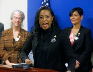 FILE - Jan. 22, 2019 file photo, Del. Jennifer Carroll Foy, D-Prince William, center, speaks during a news conference of ERA supporters after her bill was killed by a House subcommittee. (Bob Brown/Richmond Times-Dispatch via AP)