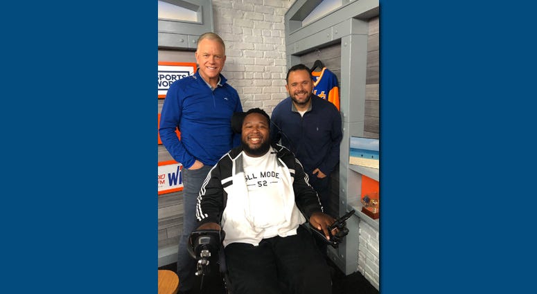 Eric LeGrand poses with Boomer and Gio.