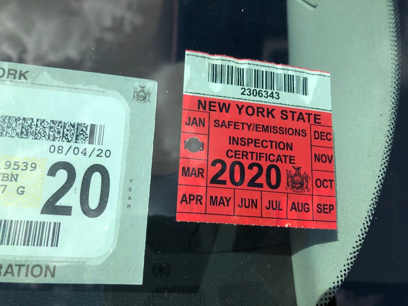 An expired New York State inspection sticker