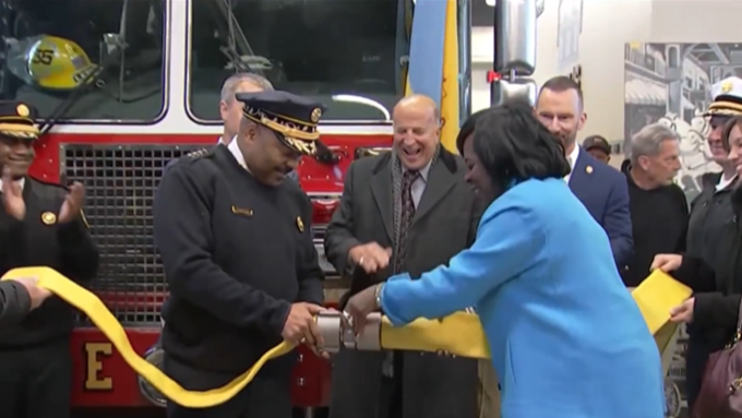 City officials marked the reopening of Engine Six with a ceremonial coupling of the fire hose, symbolically reconnecting the fire station with the community it serves.