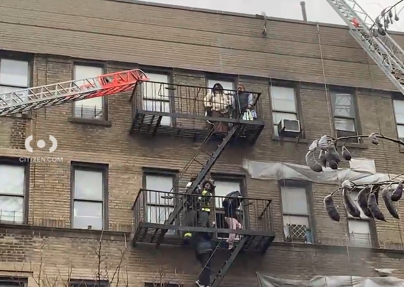 Firefighters were seen helping people out of windows