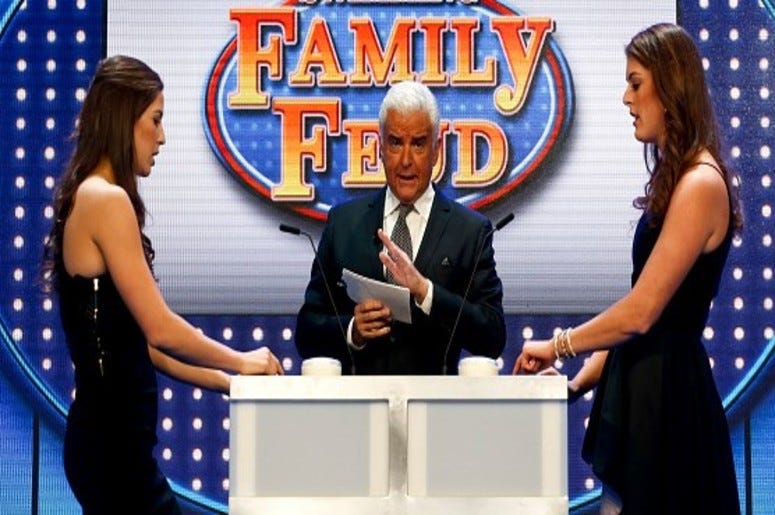 Actor John O'Hurley leads Maya DiRado and Allison Schmitt in a game of Family Feud