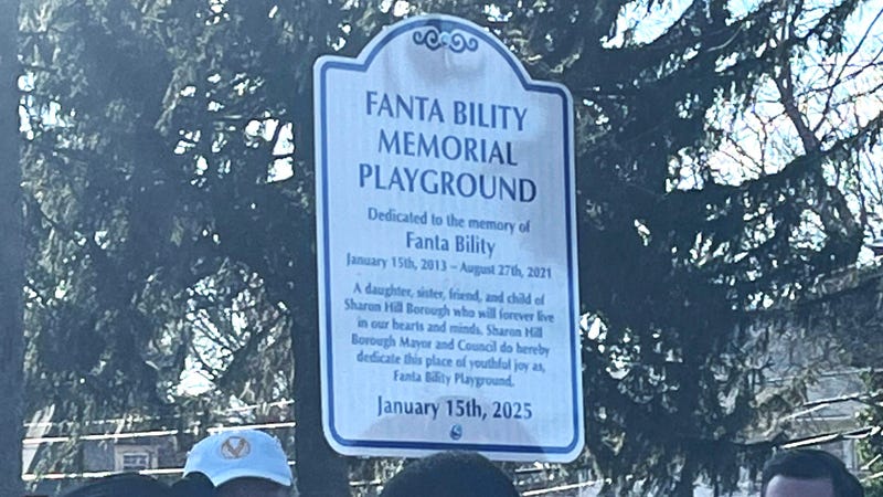 A sign that reads "Fanta Bility Memorial Playground," dedicated to her memory.