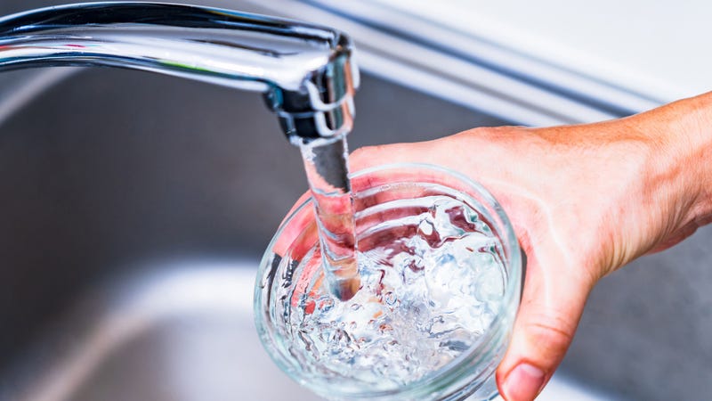 Kitchen faucet and tap water - stock photo