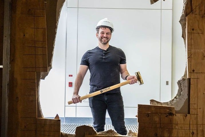 Nerd Street Gamers CEO John Fazio knocks out a wall, officially beginning construction on a new 40,000-square foot esports facility on North Broad Street.