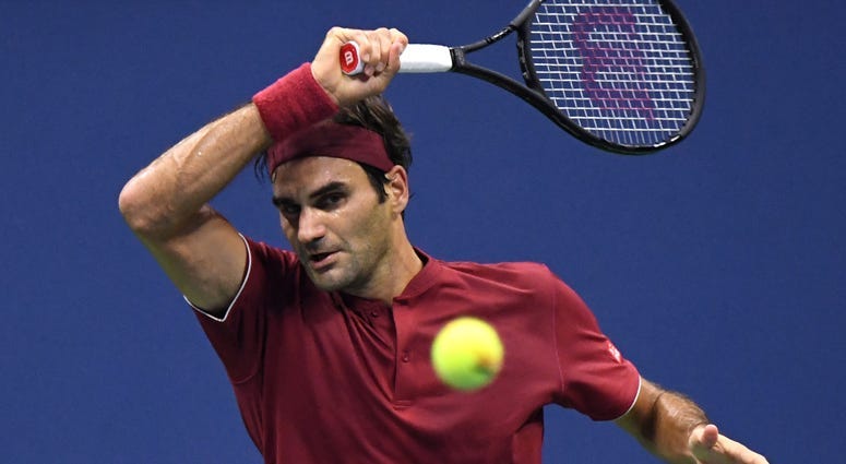 Roger Federer hits to John Millman in a round-of-16 match on Sept, 3, 2018, at USTA Billie Jean King National Tennis Center.