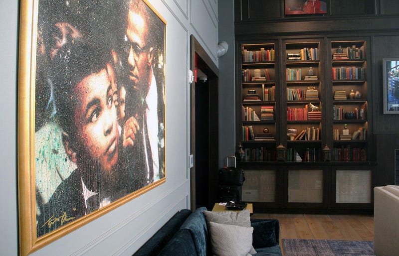 A painting of Muhammad Ali and Malcolm X inside Cam Newton's Fellaship lounge in Atlanta