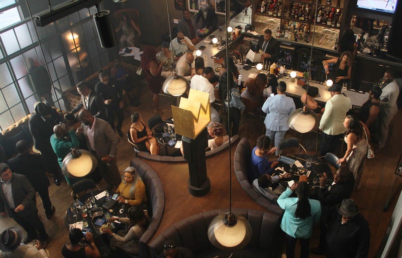 An overhead shot of the bar on the main floor inside Cam Newton's Fellaship lounge in Atlanta