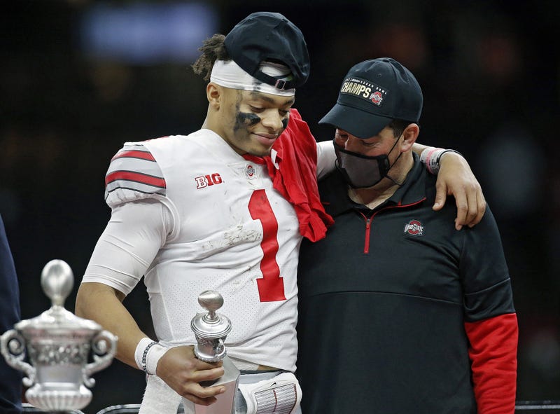 Ohio State Buckeyes head coach Ryan Day and quarterback Justin Fields share a moment after Fields was awarded the Most Outstanding Player award after beating Clemson Tigers 49-28 in the College Football Playoff semifinal at the Allstate Sugar Bowl in the Mercedes-Benz Superdome in New Orleans on Friday, Jan. 1, 2021.