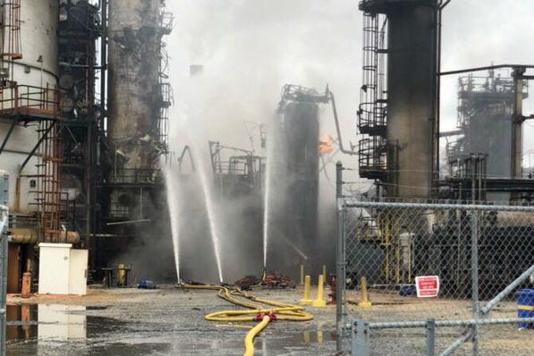 At the scene of an explosion at a Southwest Philadelphia refinery, the resulting fire is contained but not yet under control.