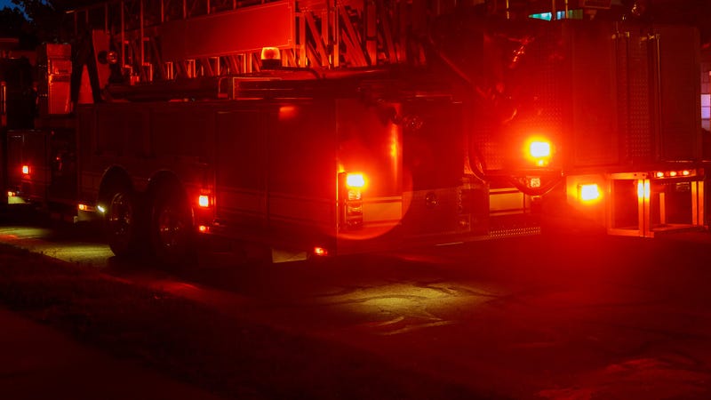 Flashing lights of red fire truck - stock photo