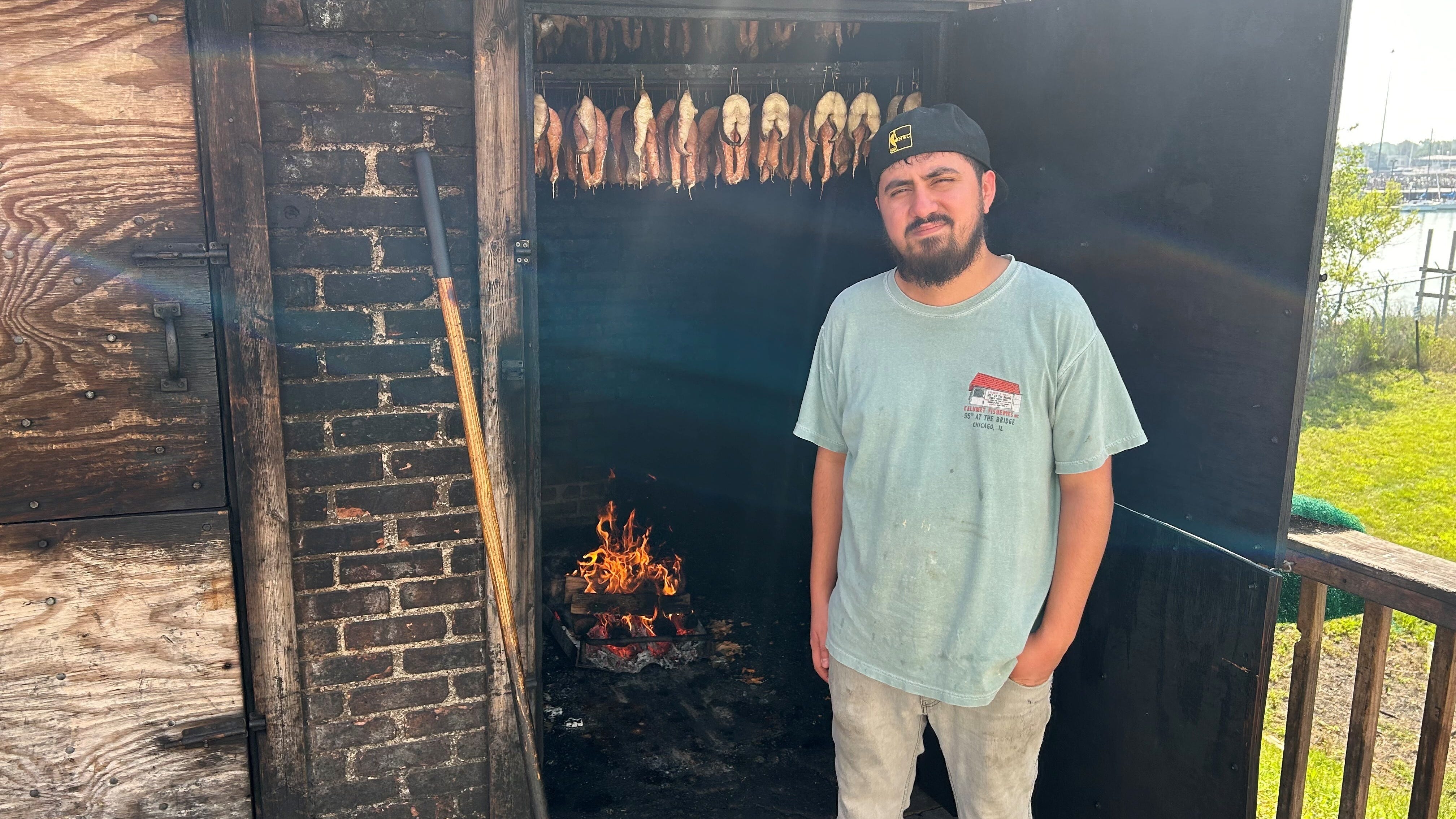 Think you're uncomfortably hot? This guy smokes fish for a living