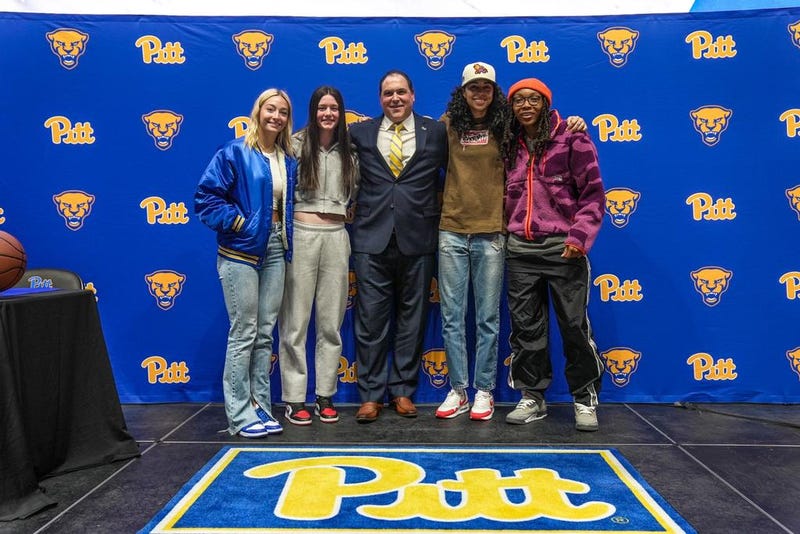 Pitt women's basketball coach Tory Verdi with Panthers players