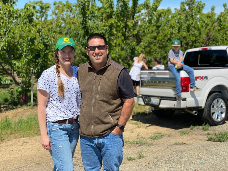 Jessica and Larry Enos, owners of 5 Star Cherries in Brentwood, CA, at their orchard.